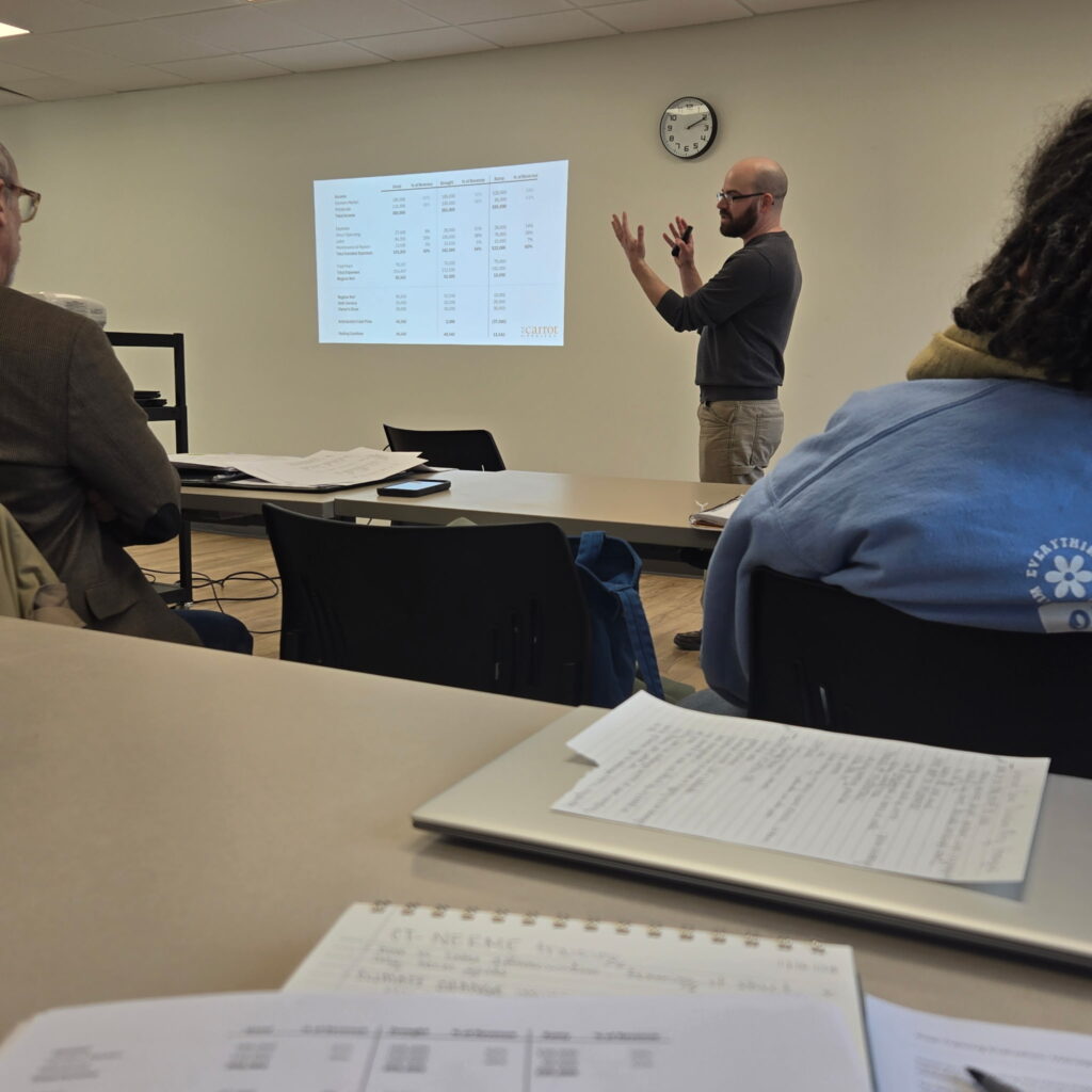 Image of person presenting information in a classroom